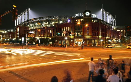Nighttime view of Coors Field near The Maven Hotel